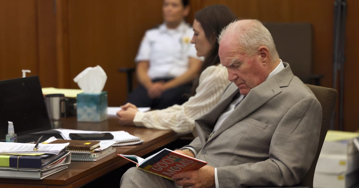 Lindsay Clancy sits in court as her defense attorney Kevin Reddington looks over a children's book marked as an exhibit during her trial at Plymouth Superior Court in Plymouth, Mass, Wednesday, August 5, 2026 (AP Photos)