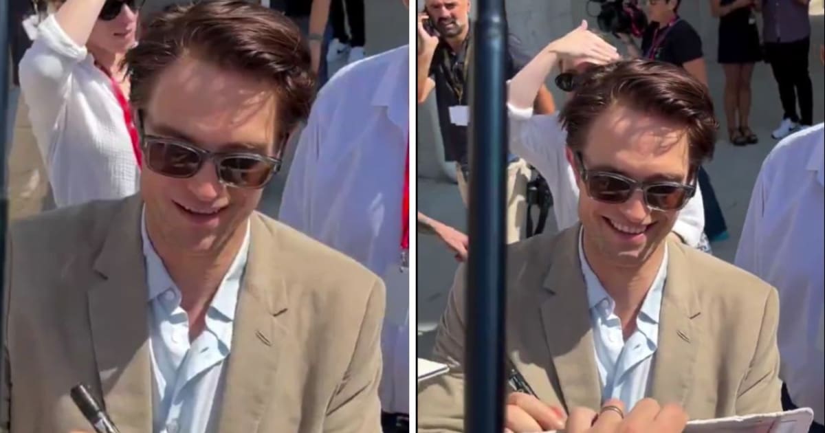 Robert Pattinson couldn’t hold back his laughter after a fan shouted one of his dialogues from 'The Odyssey' while he was busy signing autographs outside Venice’s Palazzo del Cinema (@DiscussingFilm/X)