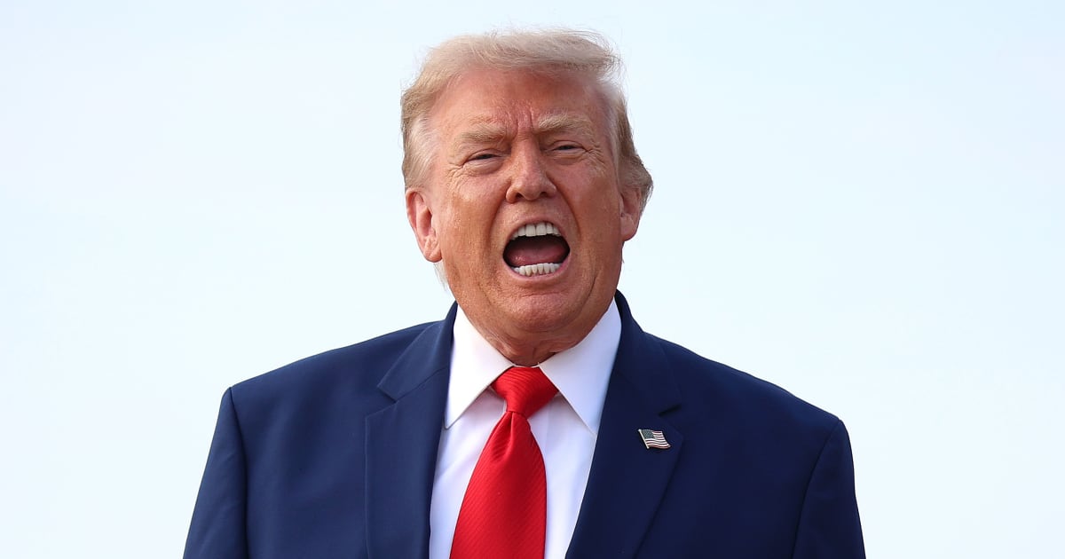 President Donald Trump calls out to reporters after getting off Air Force One on July 22, 2026, at Joint Base Andrews, Maryland (Getty Images)
