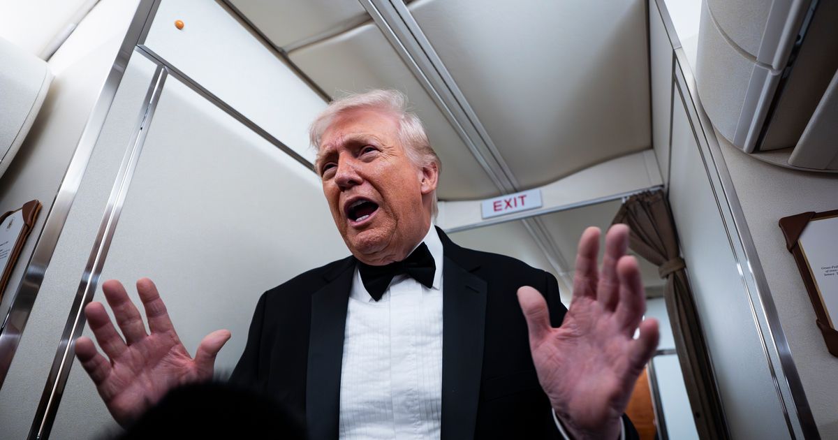 President Donald Trump speaks to reporters and members of the media on board Air Force One while flying in between Washington and West Palm Beach, Florida, on January 31, 2026 (Getty Images)