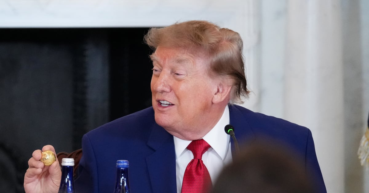 President Donald Trump holds up a gold replica of a deep sea nodule on August 7, 2026, in Washington, DC (Getty Images)