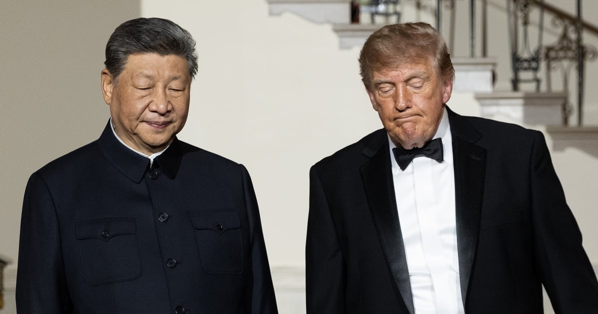 Chinese President Xi Jinping and President Donald Trump descend the grand staircase before a state dinner in the East Room of the White House on September 24, 2026, in Washington, DC (Getty Images)