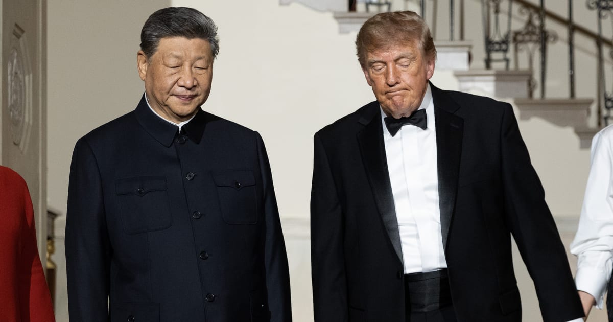 Chinese President Xi Jinping and President Donald Trump descend the grand staircase before a state dinner in the East Room of the White House on September 24, 2026, in Washington, DC (Getty Images)