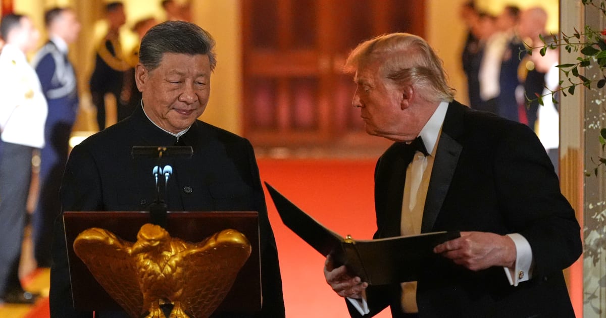 President Donald Trump talks with China's President Xi Jinping during a State Dinner in the East Room of the White House on Thursday, September 24, 2026, in Washington (AP Photo/Alex Brandon)