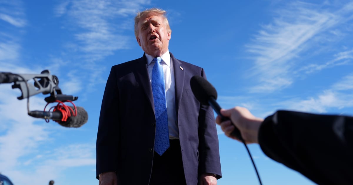 President Donald Trump speaks with reporters upon arriving at Chicago O'Hare International Airport, Sunday, September 27, 2026, in Chicago (AP Photo/Julia Demaree Nikhinson)