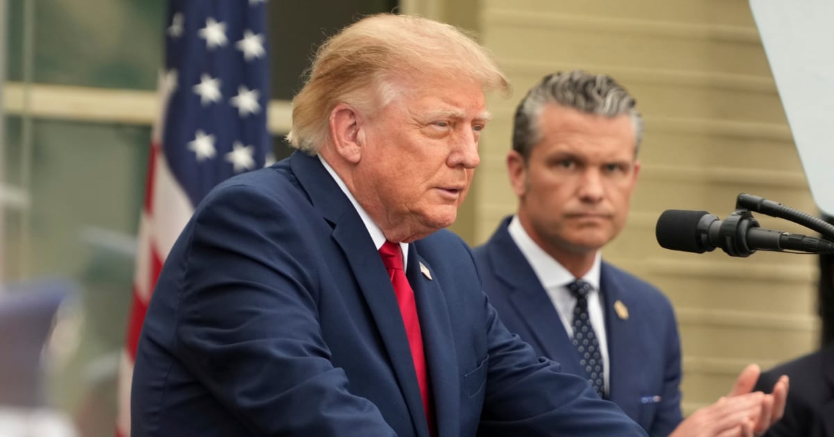 President Donald Trump spoke as Defense Secretary Pete Hegseth listened during a Pentagon observance ceremony in Washington (AP Photo/Mark Schiefelbein)