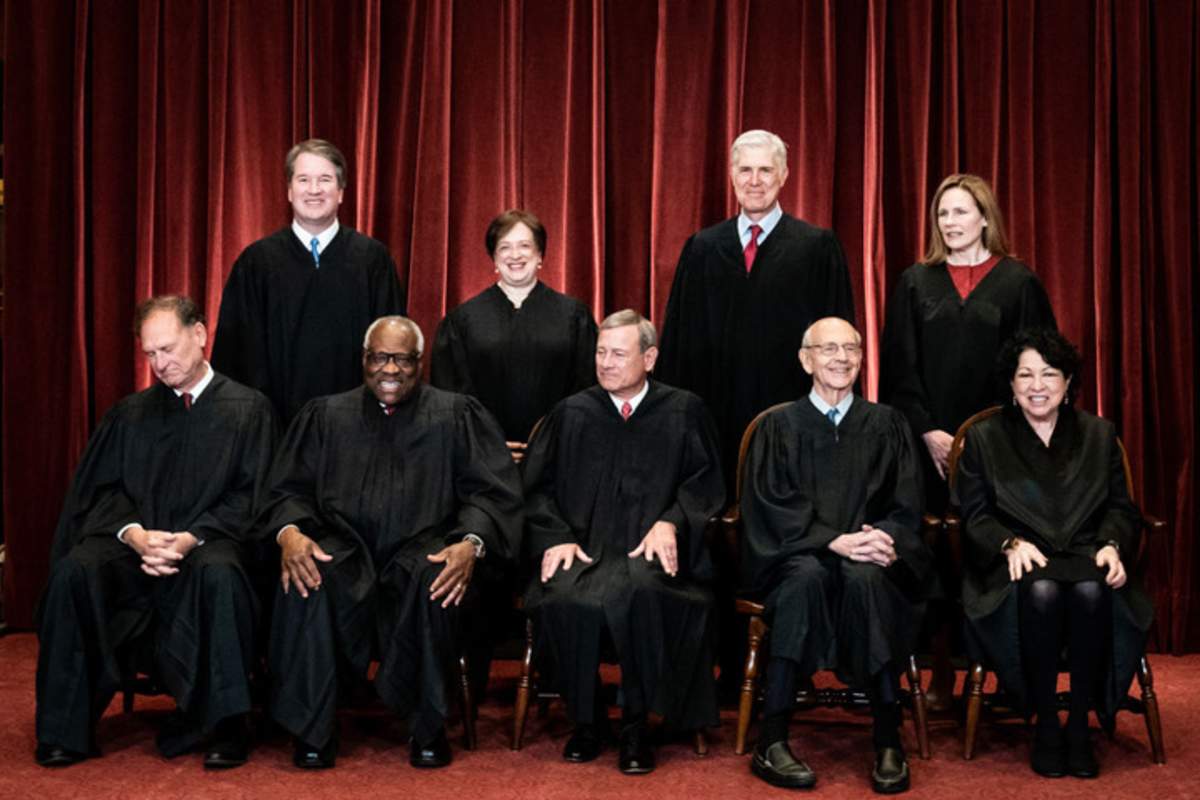 Members of the Supreme Court pose for a group photo at the Supreme Court in Washington, DC on April 23, 2021. Seated from left: Associate Justice Samuel Alito, Associate Justice Clarence Thomas, Chief Justice John Roberts, Associate Justice Stephen Breyer and Associate Justice Sonia Sotomayor, Standing from left: Associate Justice Brett Kavanaugh, Associate Justice Elena Kagan, Associate Justice Neil Gorsuch and Associate Justice Amy Coney Barrett. (Photo by Erin Schaff-Pool/Getty Images)