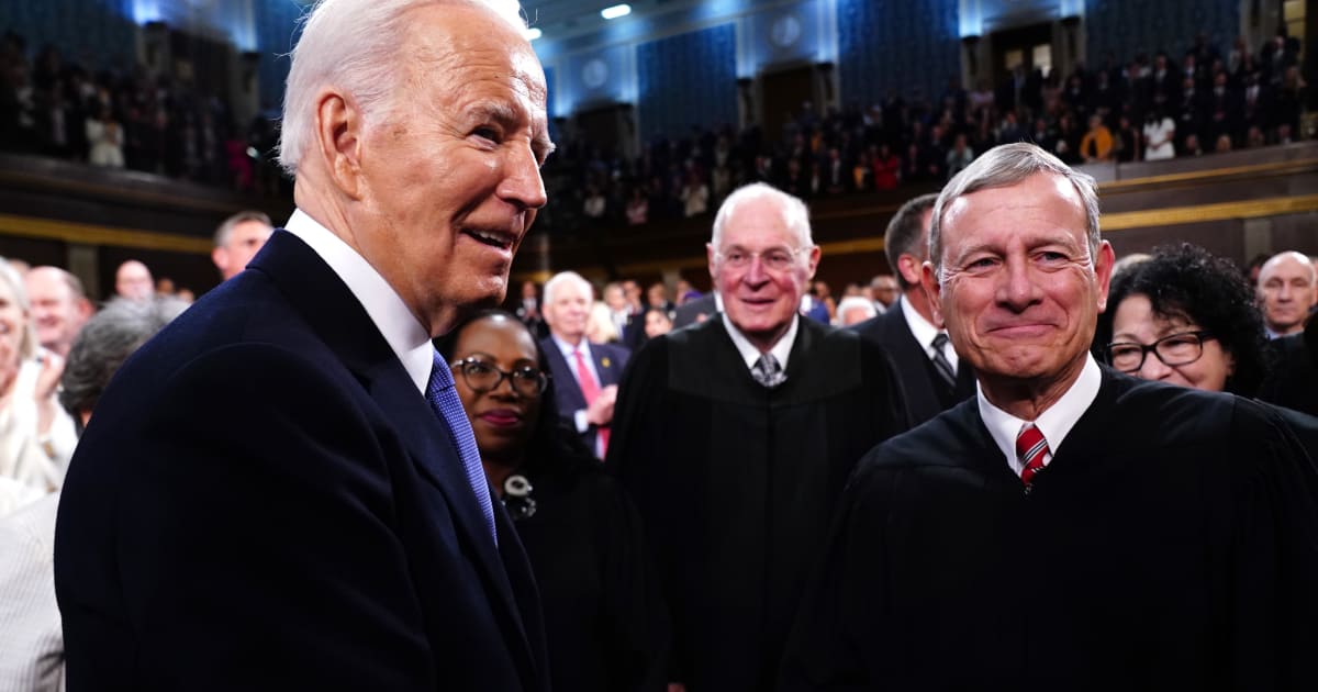 Former President Joe Biden greets Supreme Court Chief Justice John Roberts as Biden enters the House chamber at the Capital building on March 7, 2024, in Washington, DC (Shawn Thew-Pool/Getty Images)