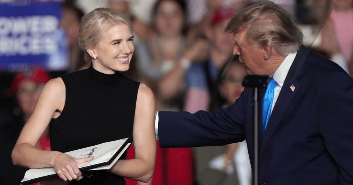Donald Trump compared Natalie Harp to ‘The Price Is Right’ after she handed him the executive order on stage (AP Photo/Charlie Riedel)