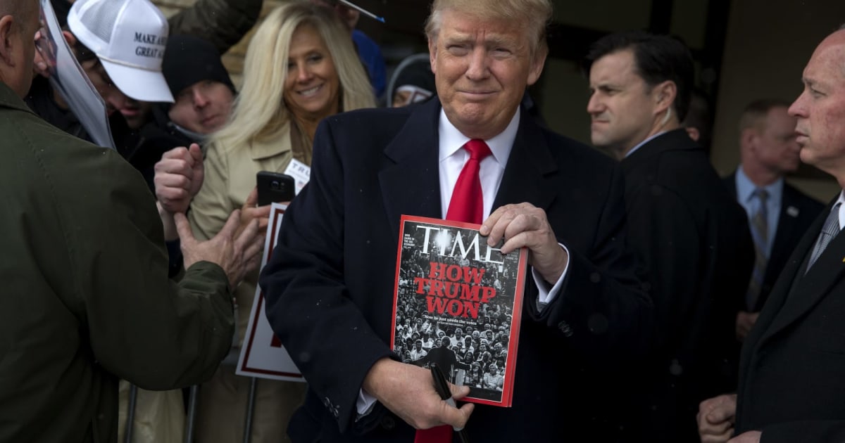 Republican presidential candidate Donald Trump holds a copy of Time Magazine outside the John Wayne Birthplace Museum on January 19, 2016 in Winterset, Iowa (Aaron P. Bernstein/Getty Images)
