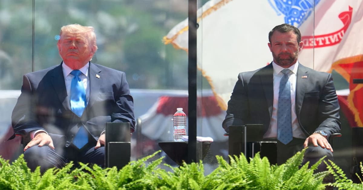 President Donald Trump and DHS Secretary Markwayne Mullin sit on the stage of the 145th Commencement exercises of the United States Coast Guard on May 20, 2026 (Mark Mirko/Connecticut Public via Getty Images)