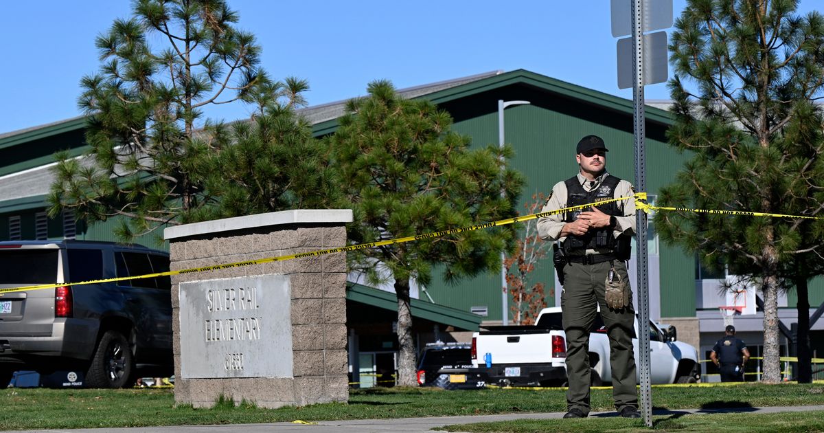 Police tape is placed outside Silver Rail Elementary School, where a shooting took place, on Thursday, October 15, 2026, in Bend, Oregon (AP Photo/Joe Kline)
